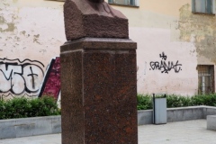 A bust of VI Lenin in a small pedestrian square
