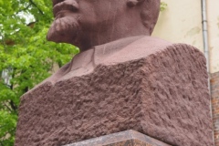A bust of VI Lenin in a small pedestrian square