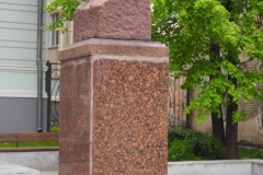 A bust of VI Lenin in a small pedestrian square
