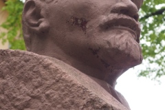 A bust of VI Lenin in a small pedestrian square