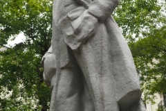 VI Lenin, standing with hand in his pocket