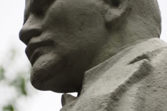 VI Lenin, standing with hand in his pocket