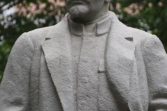 VI Lenin, standing with hand in his pocket