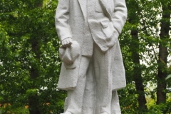 VI Lenin, standing with hand in his pocket