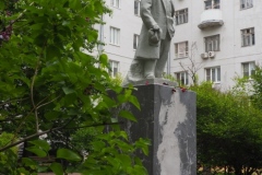 VI Lenin, standing with hand in his pocket